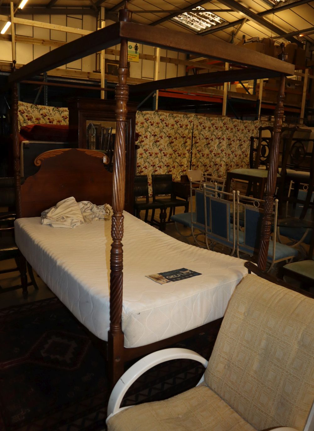 An early 19th century mahogany single-size four poster campaign bed, L.110cm, H.210cm
